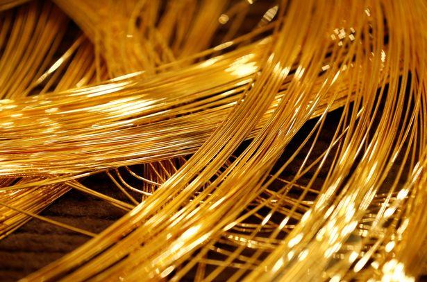 A close up view of a gold Christmas tree decorated with 19 kilograms 418 lbs of pure gold wires 2